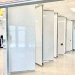 Modernfold Acousti-Seal operable walls divide a large office space.