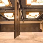 Modernfold Acousti-Seal operable walls divide an event space.