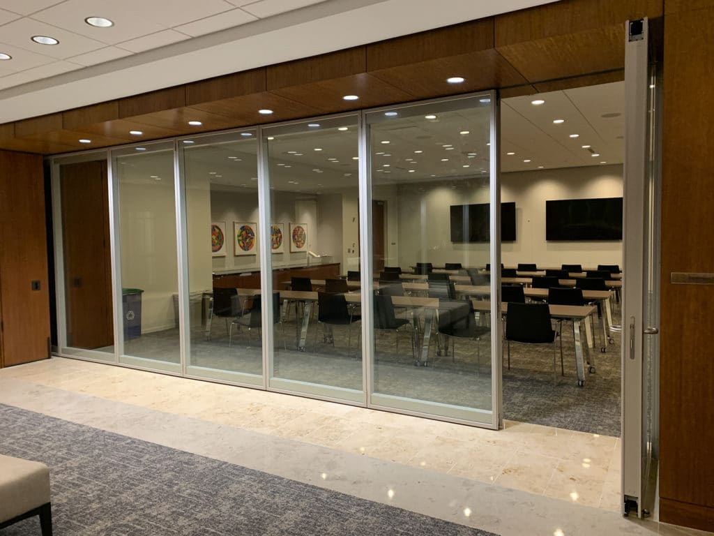 Modernfold Acousti-Clear glass walls in a law firm conference room.