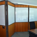 Modernfold motorized panel systems in an office conference room.