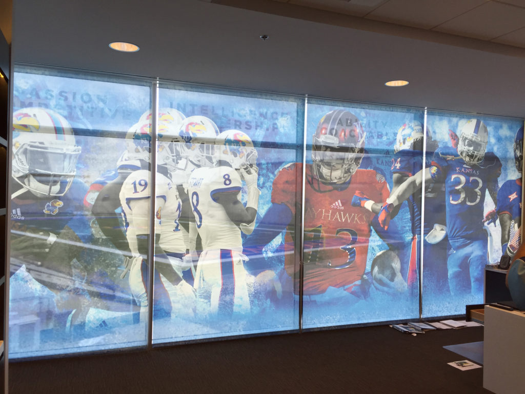 Custom graphics on commercial rollershades in an athletic facility.