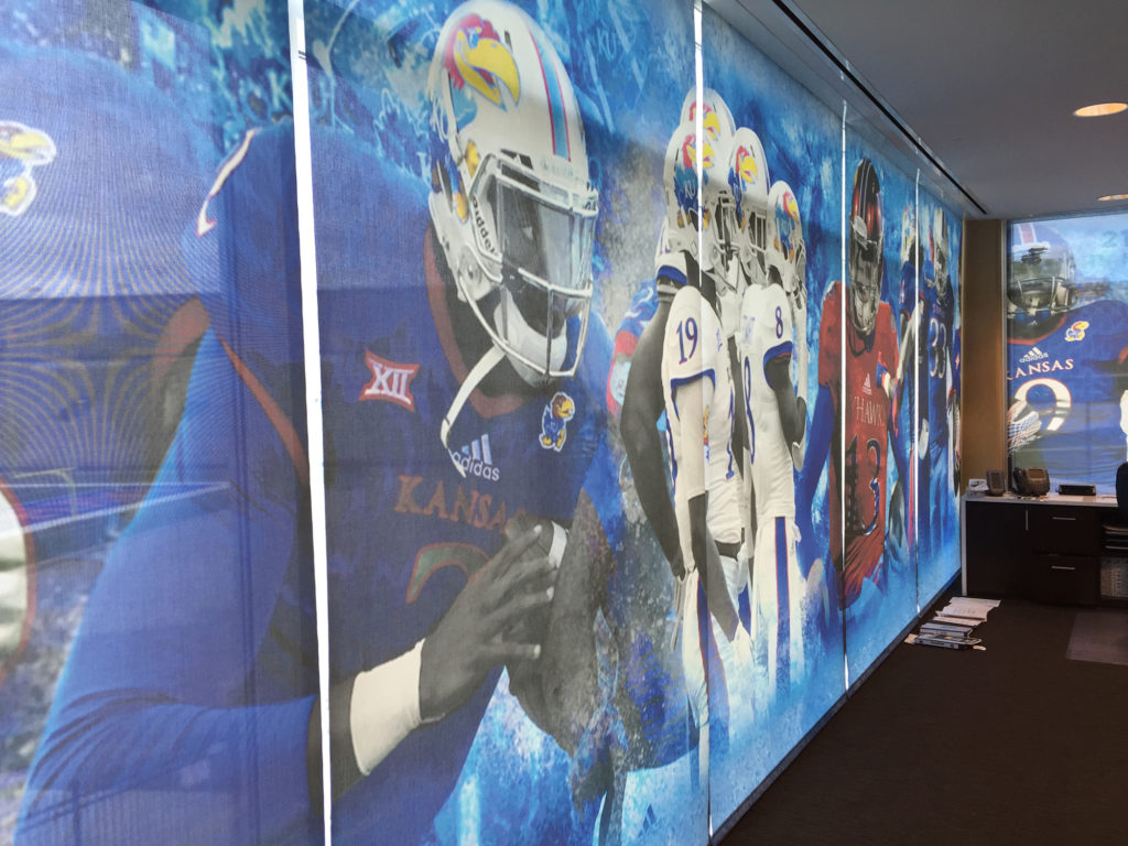 Commercial rollershades with custom graphics in an athletic facility