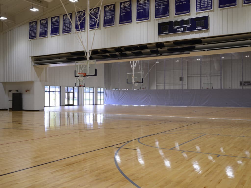 Skyfold Classic operable wall fully retracted in a high school gymnasium.