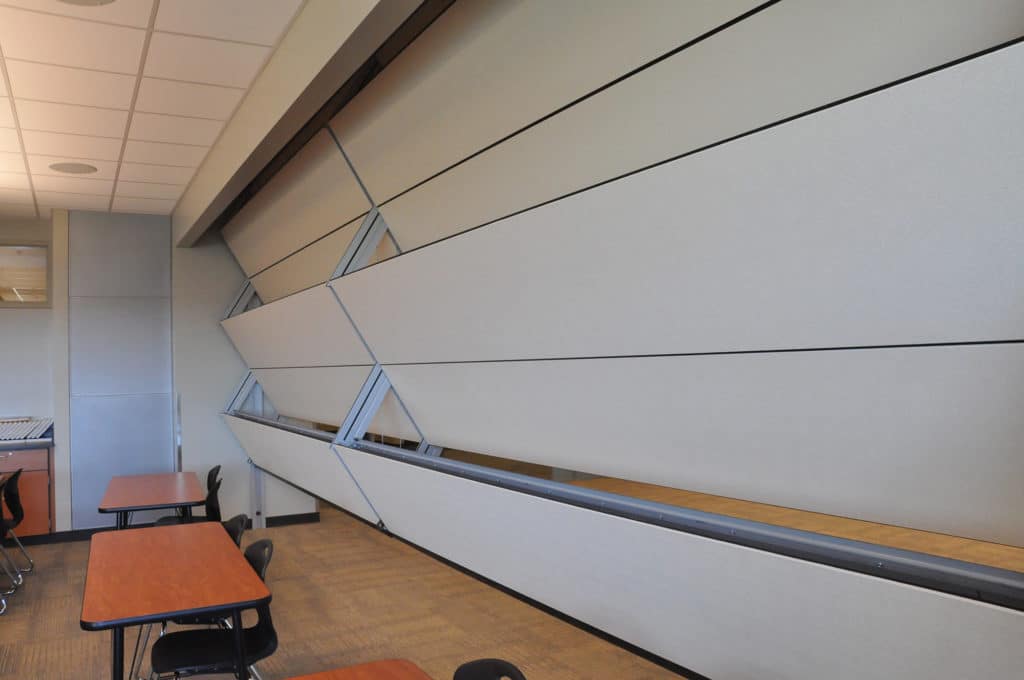 Skyfold operable partition partially retracted in a classroom in Blue Valley Southwest High School.