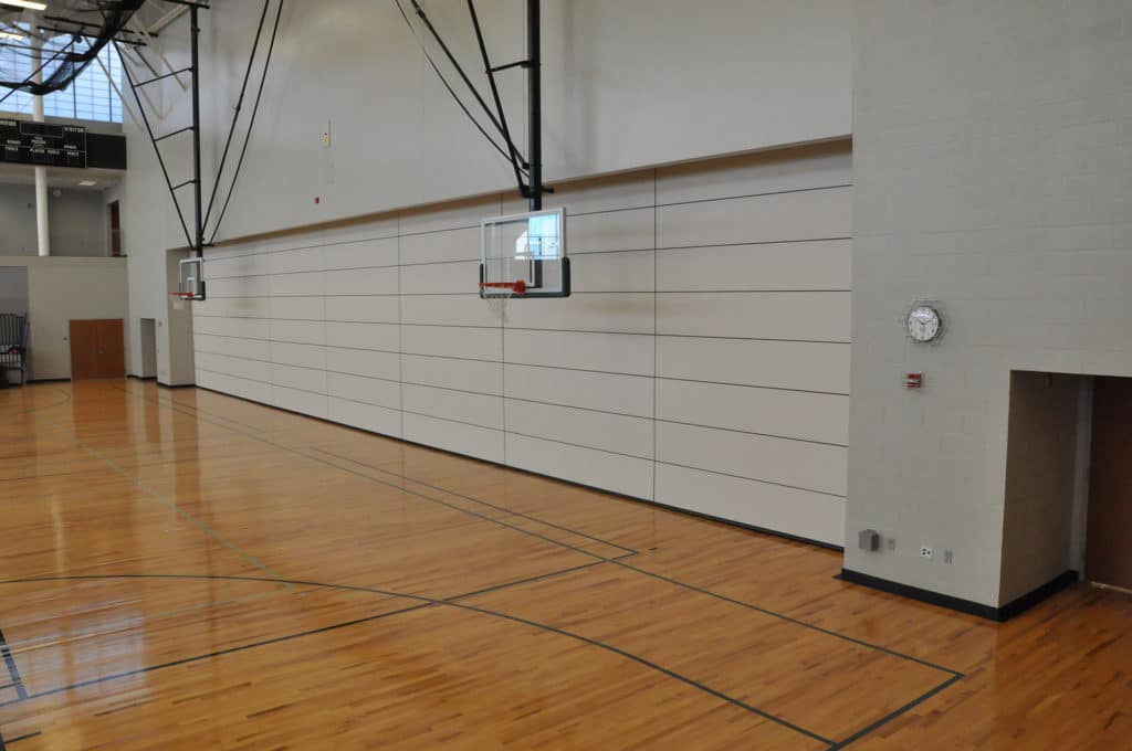 Skyfold operable wall in the gym behind the basketball nets at Blue Valley Southwest High School.