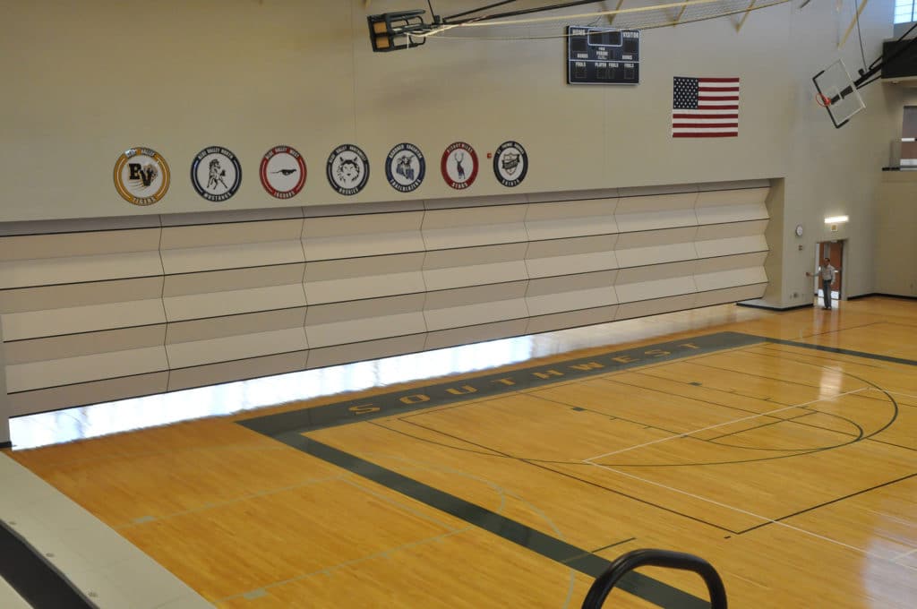 Skyfold operable wall retracting in the Blue Valley Southwest High School gym.