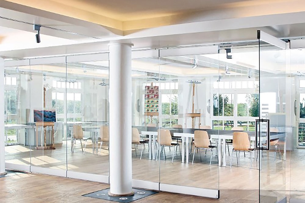 Modernfold ComfortDrive operable glass walls in a school.