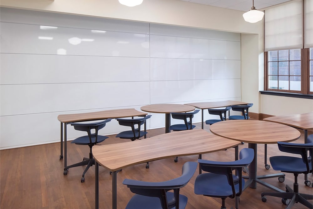Skyfold operable wall with markerboard surface in a classroom.