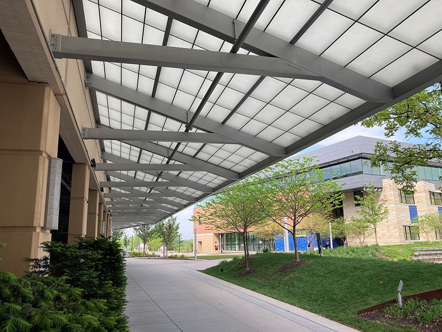 Transluscent exterior canopy over a library entrance to control daylighting