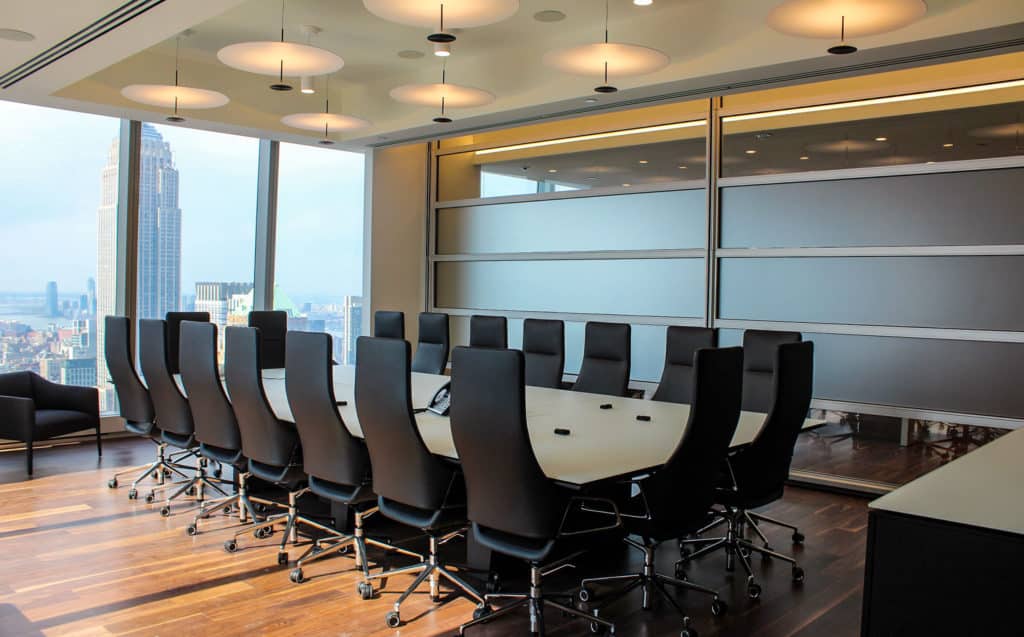 Skyfold Mirage glass operable wall, fully extended in an office conference room.
