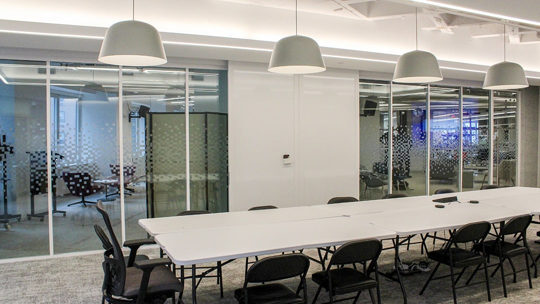 Conference room with custom-etched ZONA glass walls.