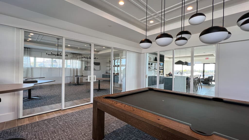 Community center billiards room with glass walls.