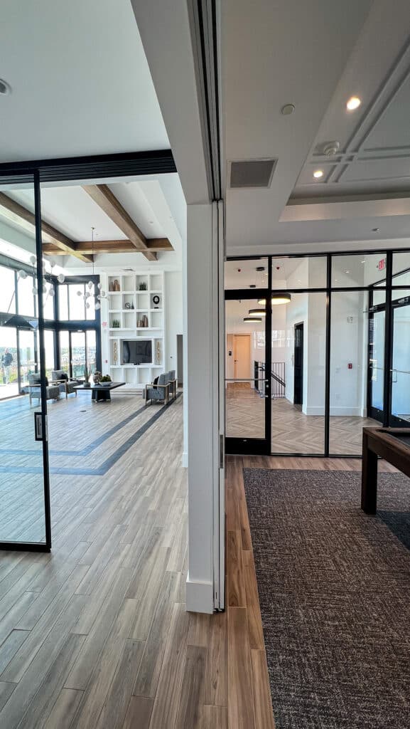 Community space interior with ZONA glass operable walls.