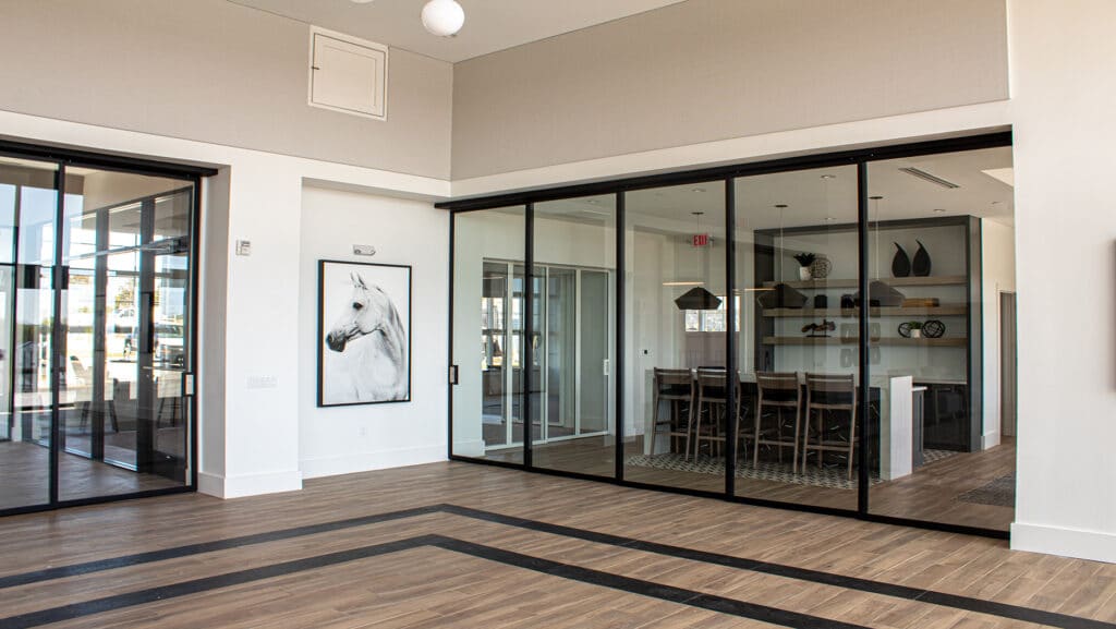 Community function room with ZONA glass operable walls.