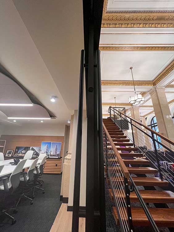 Open stairs in two-story office.