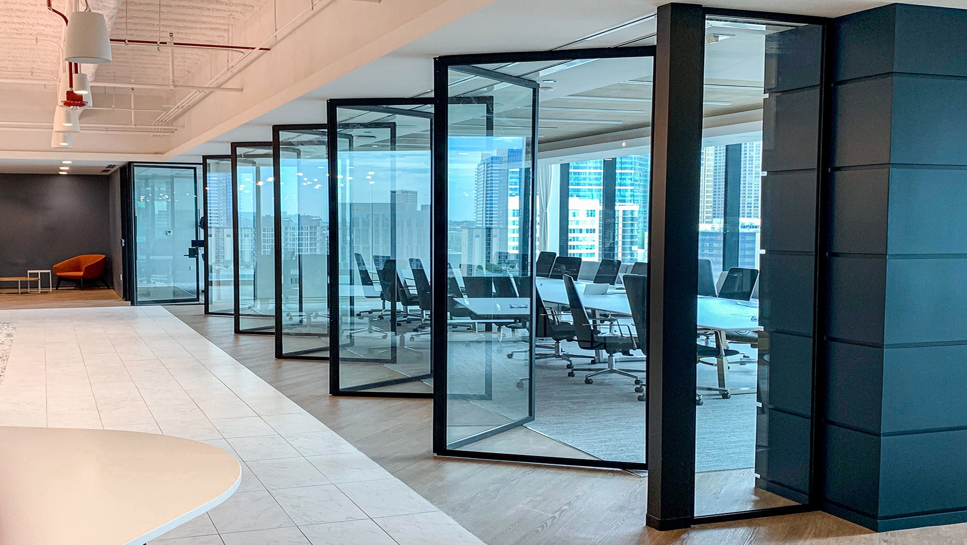 Office room with operable glass walls.