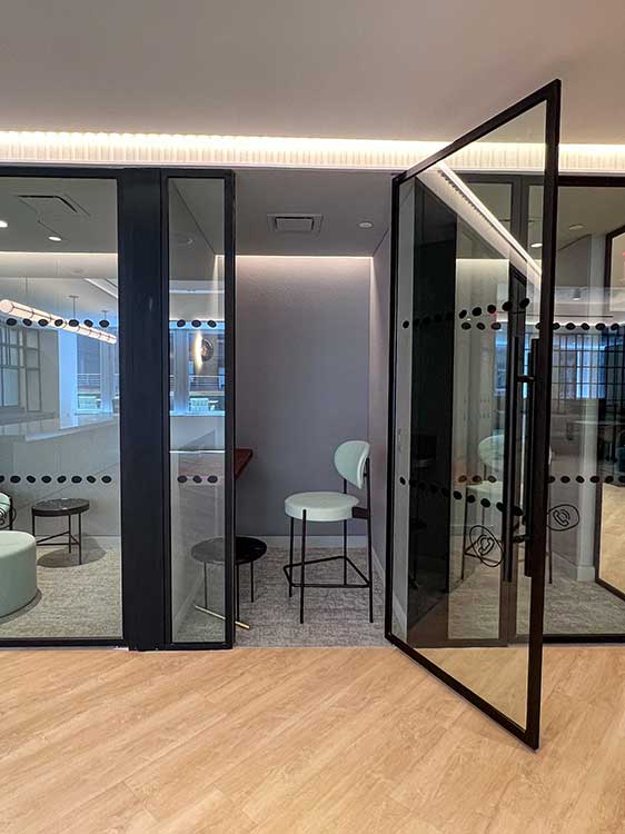 Private office spaces with glass doors.