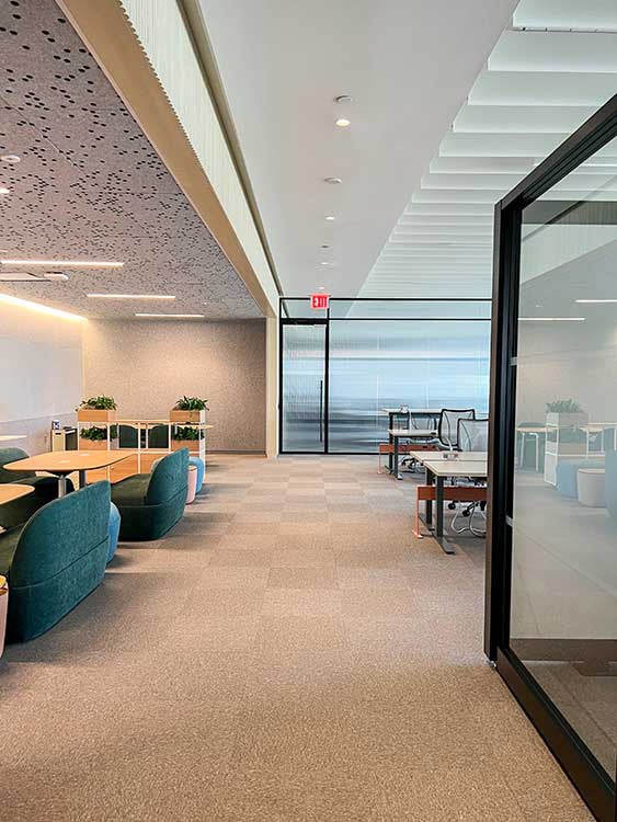 Glass partitions in a large office.