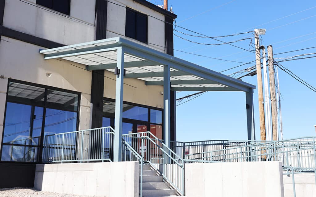 Translucent canopy over commercial building entrance.